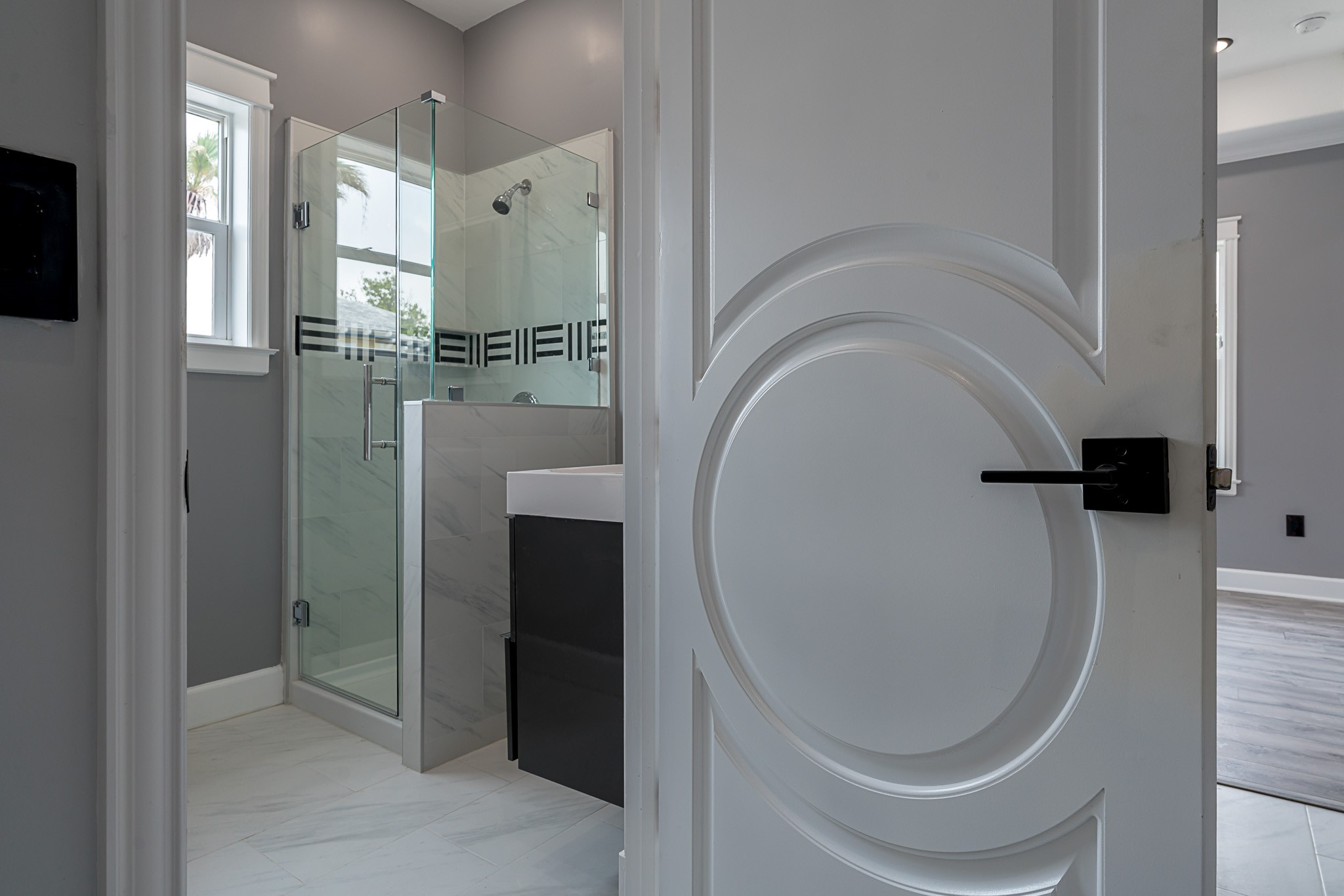 1801 Rosenberg Street, Unit 204 Galveston, TX 77550 - Photo 8 of 27 view of a bathroom with a bathtub and shower