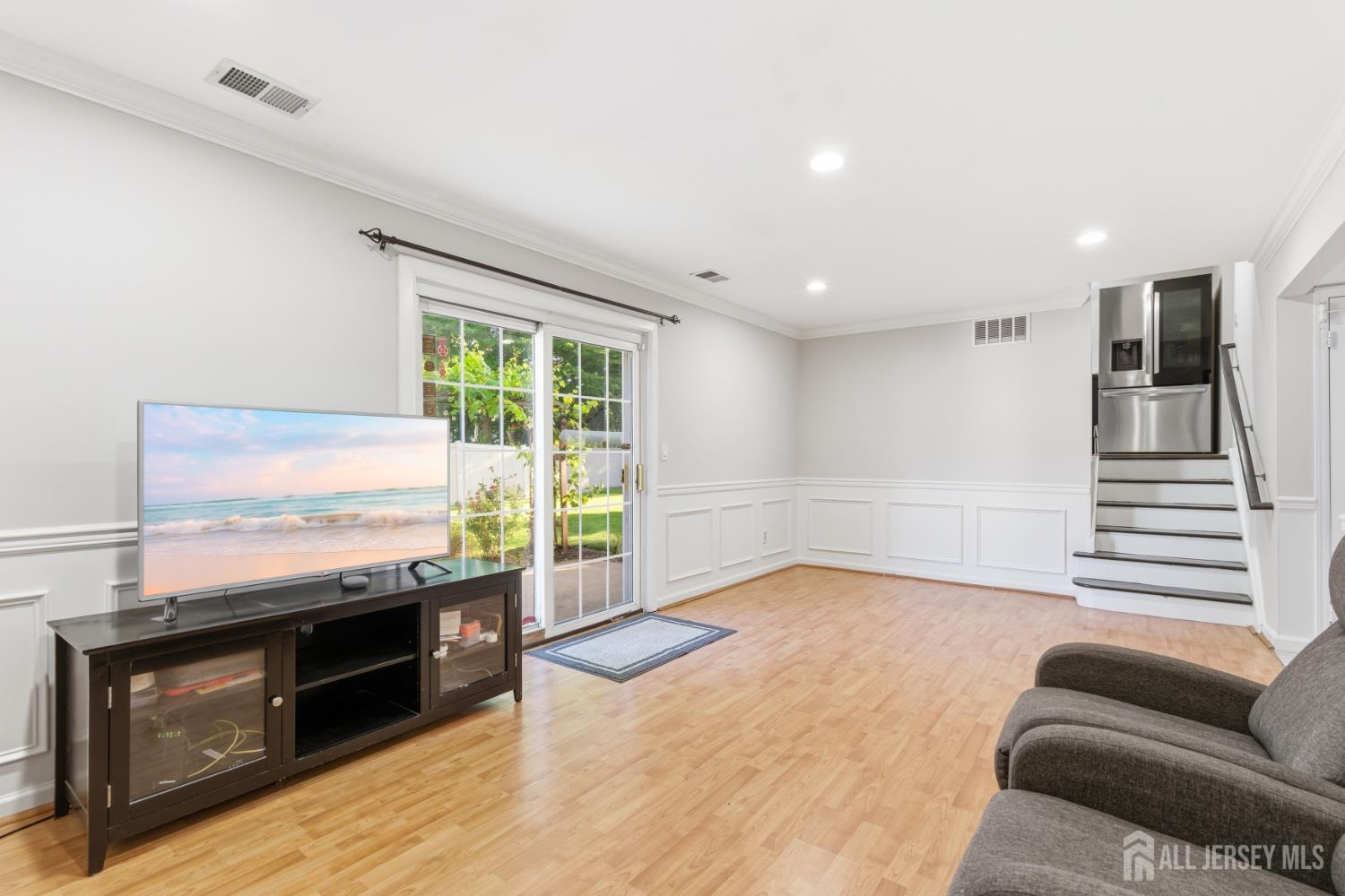 5 McKinley Street Edison, NJ 08820 - Photo 10 of 38 a living room with stainless steel appliances granite countertop furniture and a flat screen tv