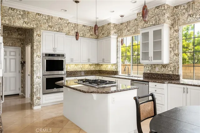 a view of a bedroom with furniture and windows