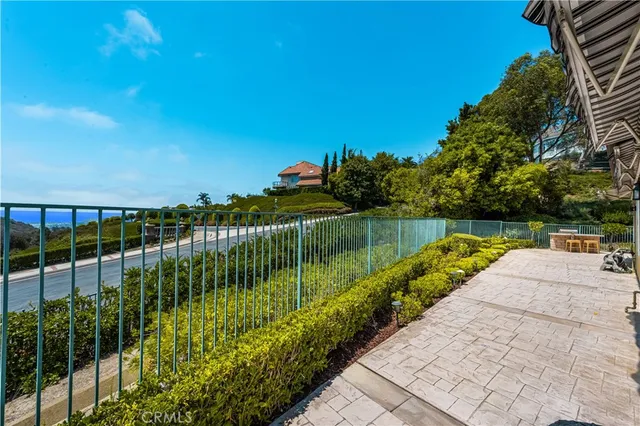 a view of a patio with a table and chairs