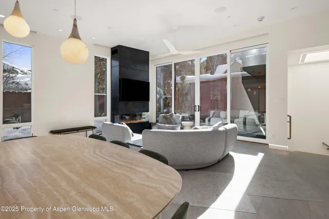 a living room with couches and a flat screen tv