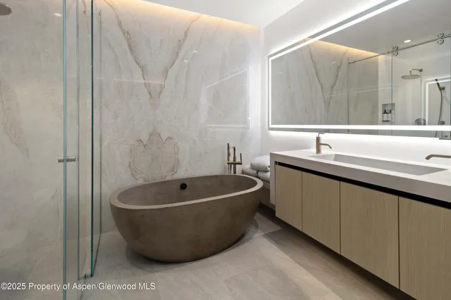 a bath room with a sink and a bathtub