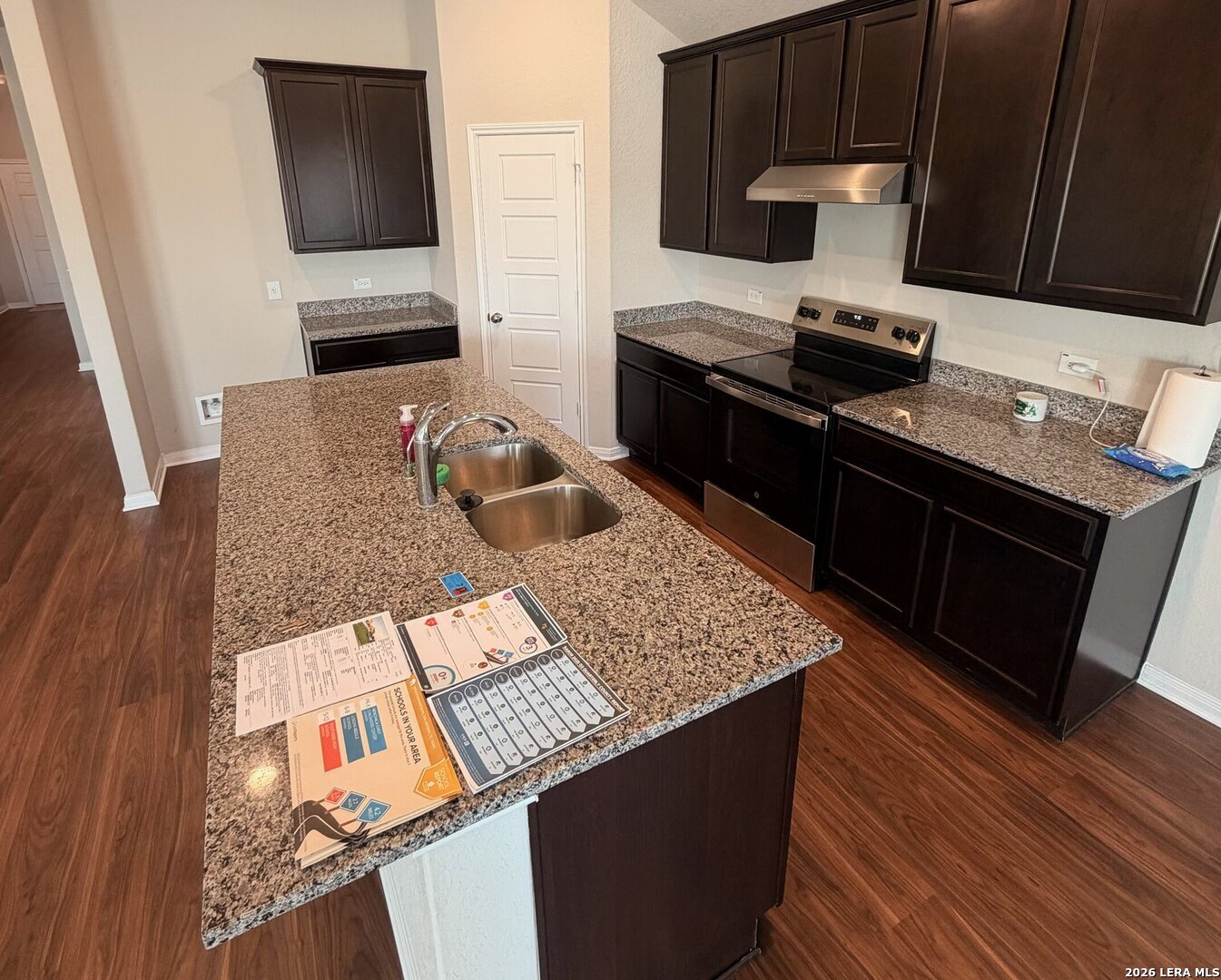 20929 Pleasanton Road San Antonio, TX 78264 - Photo 14 of 51 a kitchen with granite countertop a stove and a microwave