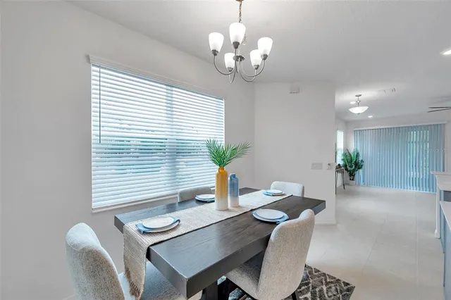 a dining room with furniture and window