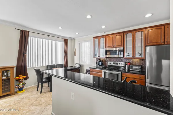 a dining room with furniture and window