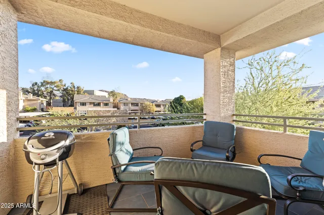 a view of a lake with couches and city view