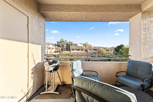 a view of playground with a couch and chairs
