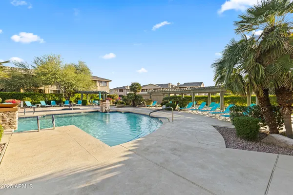 a room with pool table flat screen tv and windows
