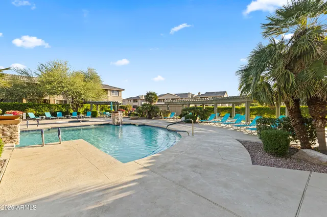 a room with pool table flat screen tv and windows