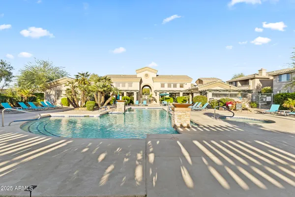 a kitchen with stainless steel appliances granite countertop a stove sink and cabinets