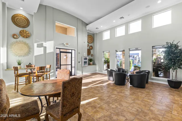 a view of a chairs and table in a patio