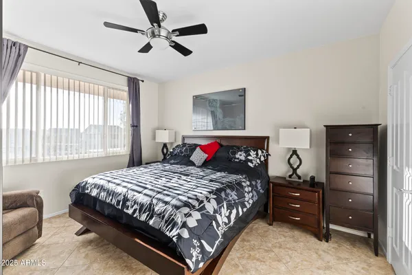 a bathroom with a granite countertop sink toilet a mirror and shower