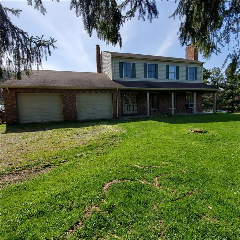 266 Catalpa Road Chicora, PA 16025 - Photo 1 of 23 a view of a house with yard and a tree