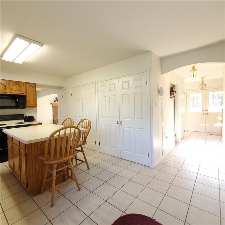 266 Catalpa Road Chicora, PA 16025 - Photo 12 of 23 a kitchen with stainless steel appliances a stove a sink and a refrigerator
