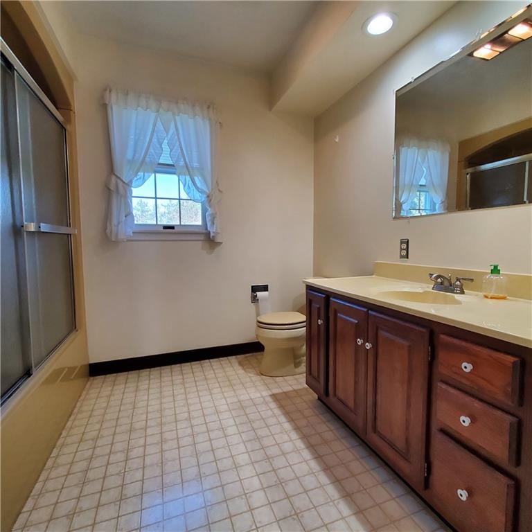 266 Catalpa Road Chicora, PA 16025 - Photo 15 of 23 a bathroom with a sink a toilet and a mirror