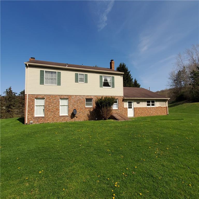 266 Catalpa Road Chicora, PA 16025 - Photo 2 of 23 a front view of a house with a garden