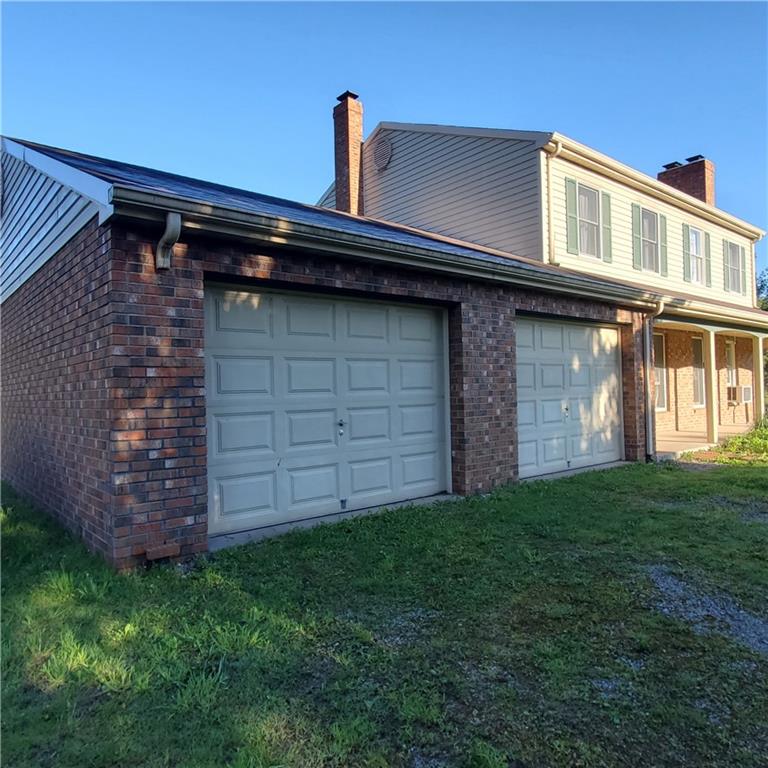 266 Catalpa Road Chicora, PA 16025 - Photo 22 of 23 a front view of a house with garden