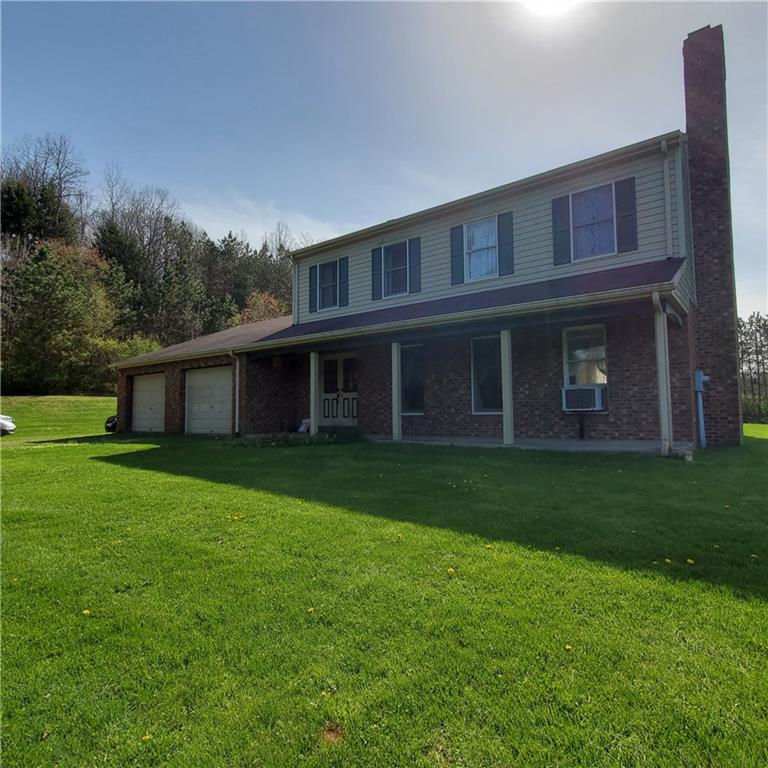 266 Catalpa Road Chicora, PA 16025 - Photo 23 of 23 a view of a house with backyard and garden