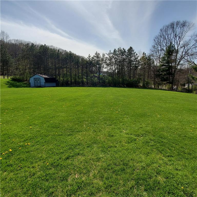 266 Catalpa Road Chicora, PA 16025 - Photo 3 of 23 a view of a field of grass and trees