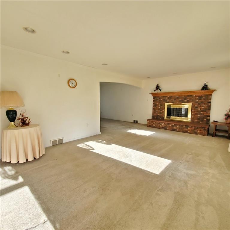 266 Catalpa Road Chicora, PA 16025 - Photo 8 of 23 a view of a livingroom with a furniture and a flat screen tv