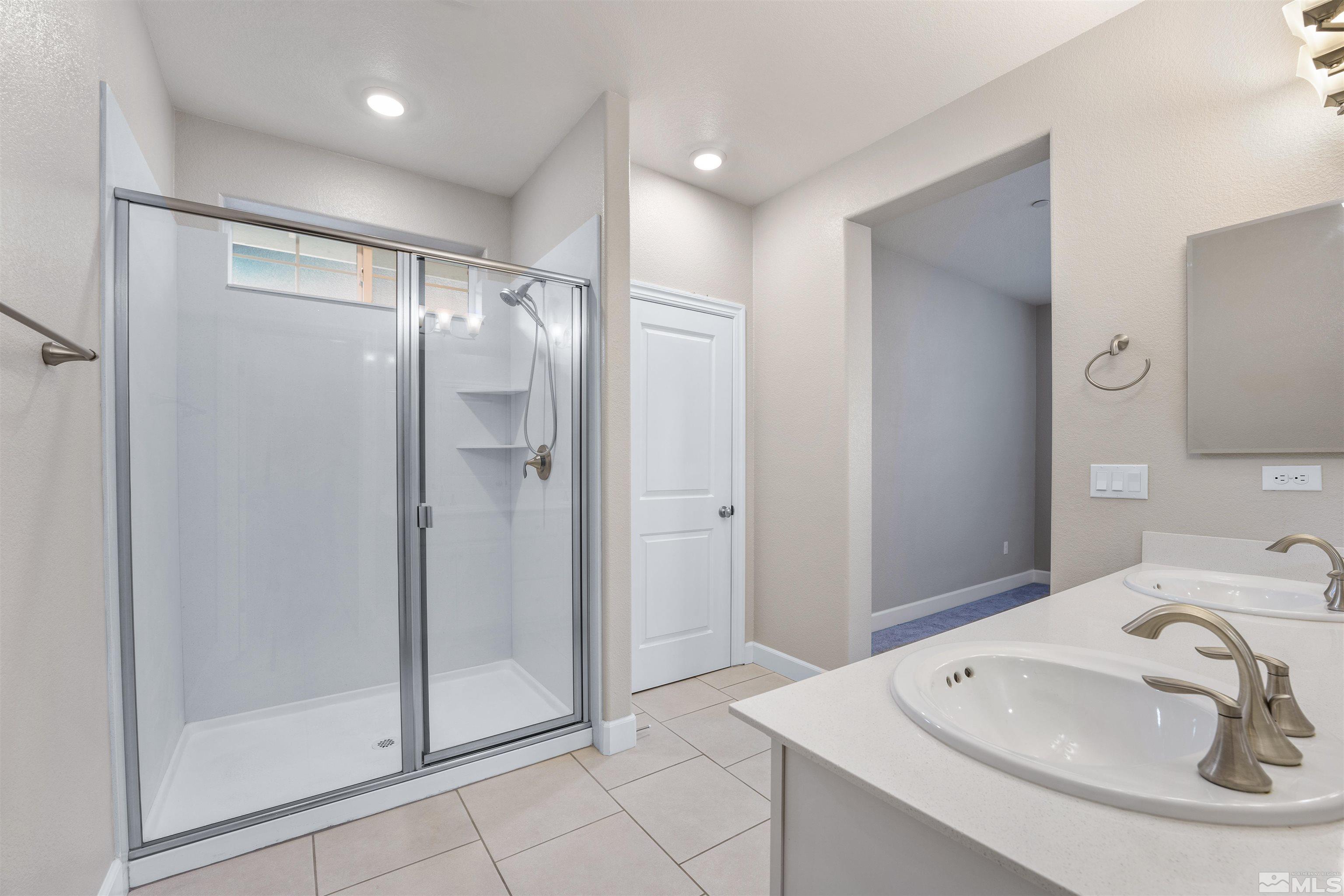 1945 Sea Horse Road, Unit A Reno, NV 89521 - Photo 17 of 25 a bathroom with a bathtub and a sink