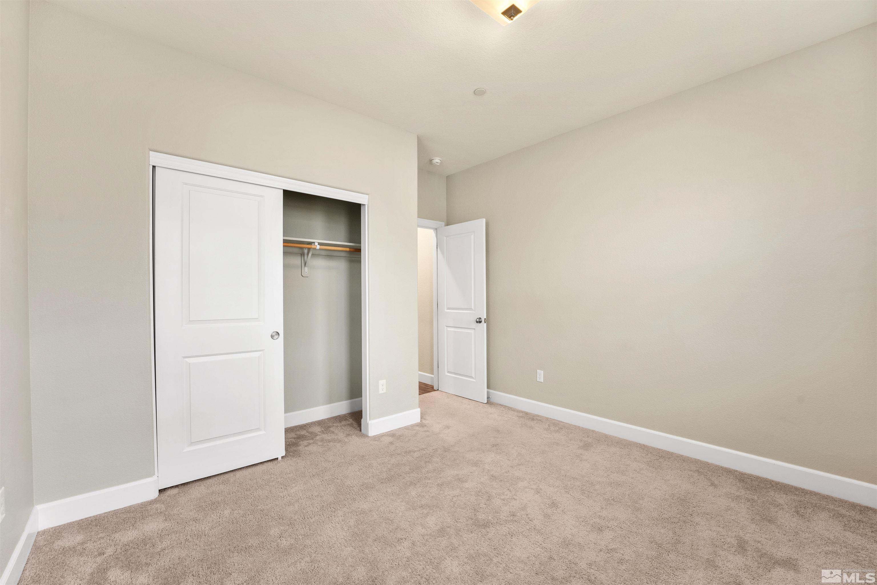 1945 Sea Horse Road, Unit A Reno, NV 89521 - Photo 19 of 25 an empty room with closet area