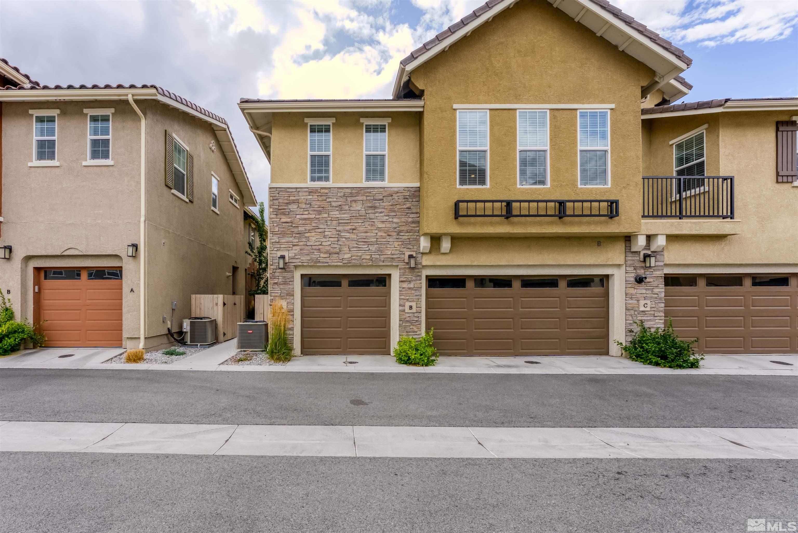 1945 Sea Horse Road, Unit A Reno, NV 89521 - Photo 2 of 25 a front view of a house with yard