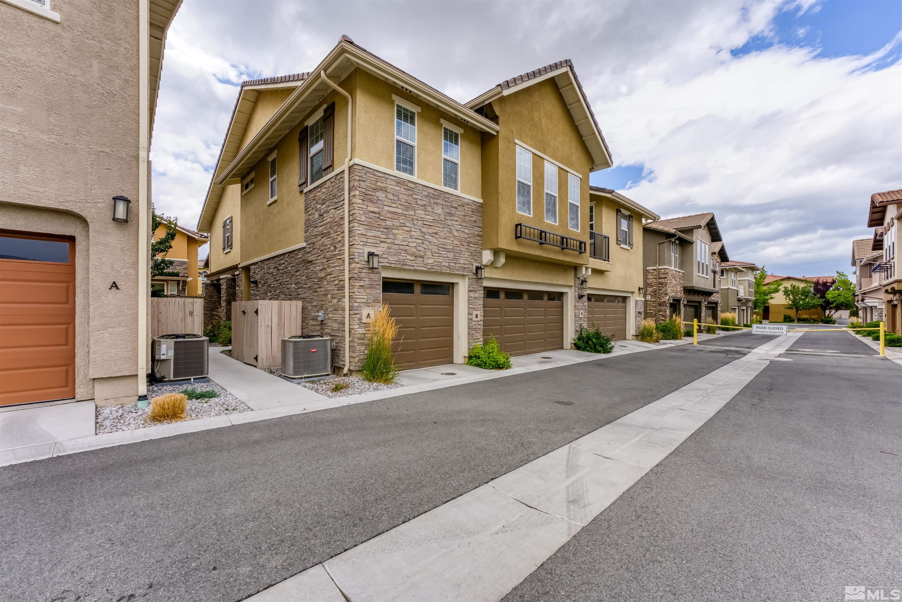 1945 Sea Horse Road, Unit A Reno, NV 89521 - Photo 3 of 25 a front view of a house with a street