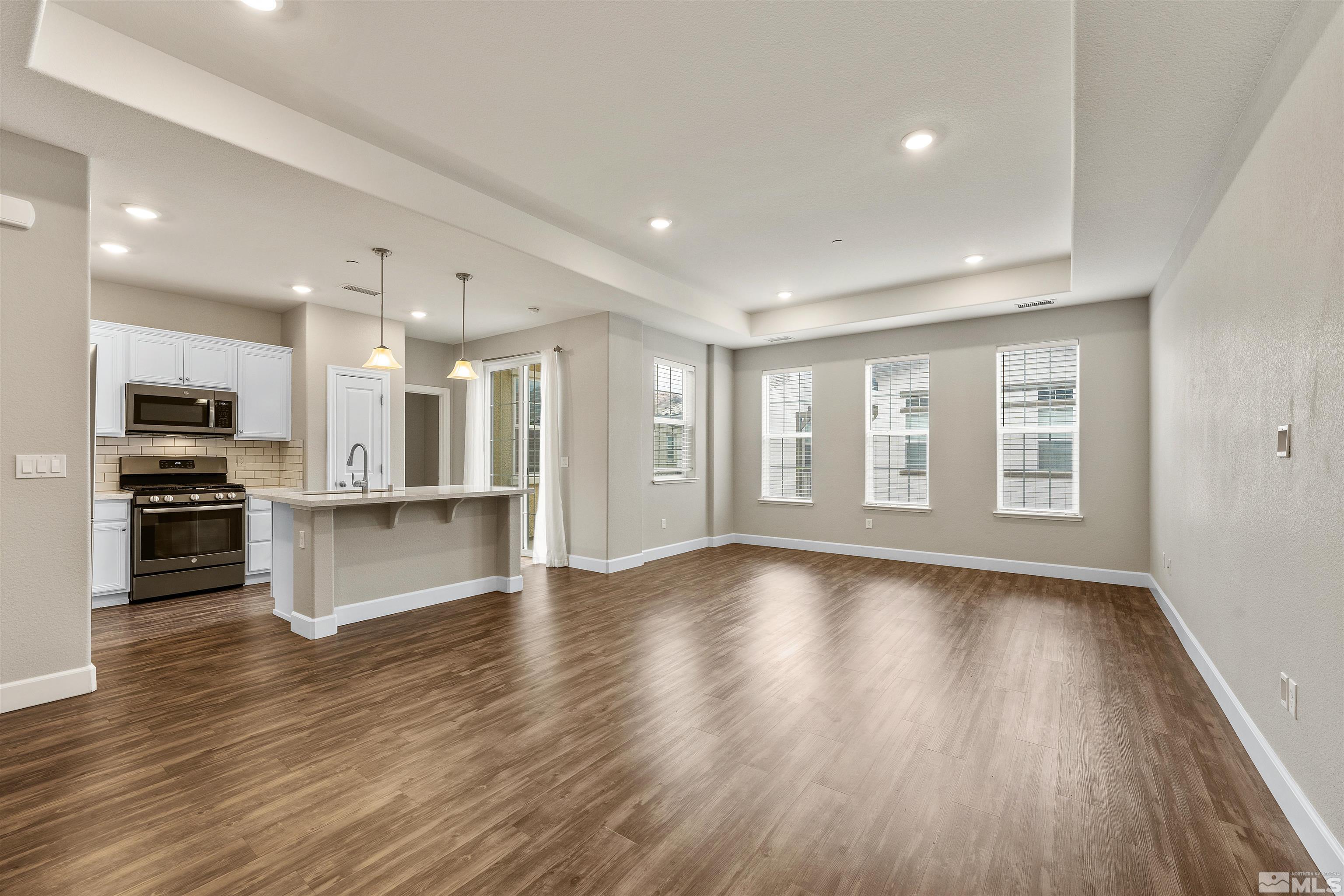 1945 Sea Horse Road, Unit A Reno, NV 89521 - Photo 5 of 25 a view of kitchen with wooden floor and electronic appliances