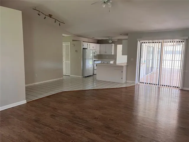 a view of a kitchen with wooden floor