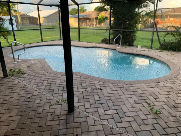 a view of a swimming pool with a sitting area