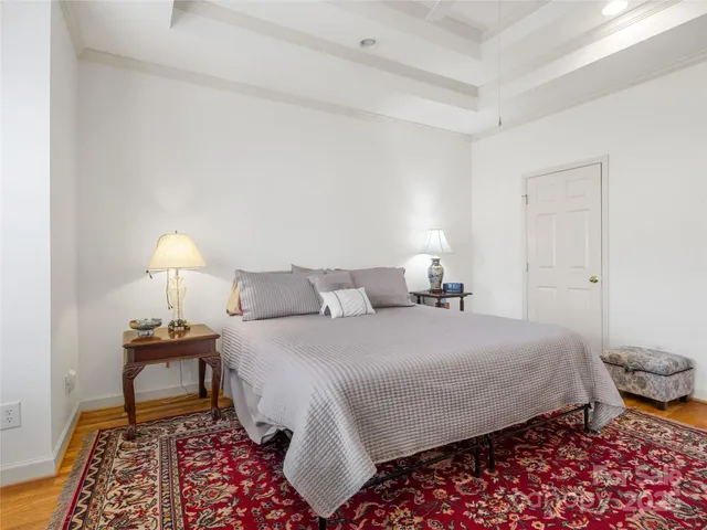 a bedroom with bed and a lamp