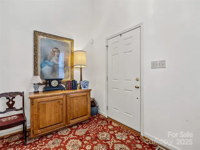 a bedroom with a bed and a mirror