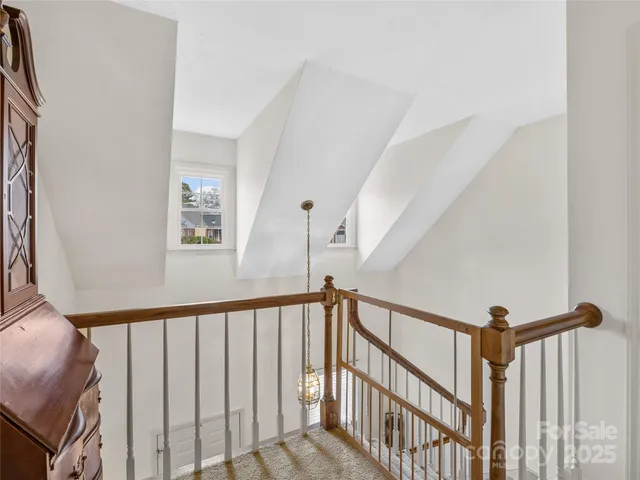 a view of a hallway with stairs