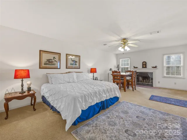 a spacious bedroom with a bed and window