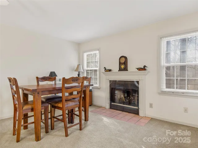 a view of a livingroom with furniture and a fireplace