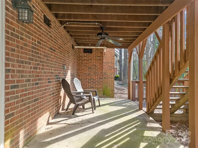an aerial view of a house with swimming pool and mountain view
