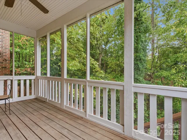a view of balcony with wooden floor