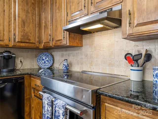 a kitchen with a stove and cabinets
