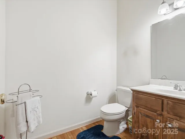 a white toilet sitting next to a bathroom sink