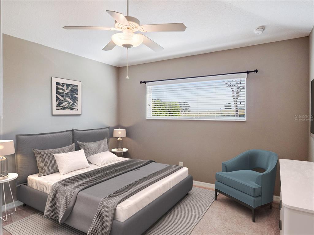 20642 Prince Ranier Place Leesburg, FL 34748 - Photo 13 of 59 a bedroom with bed and a couch