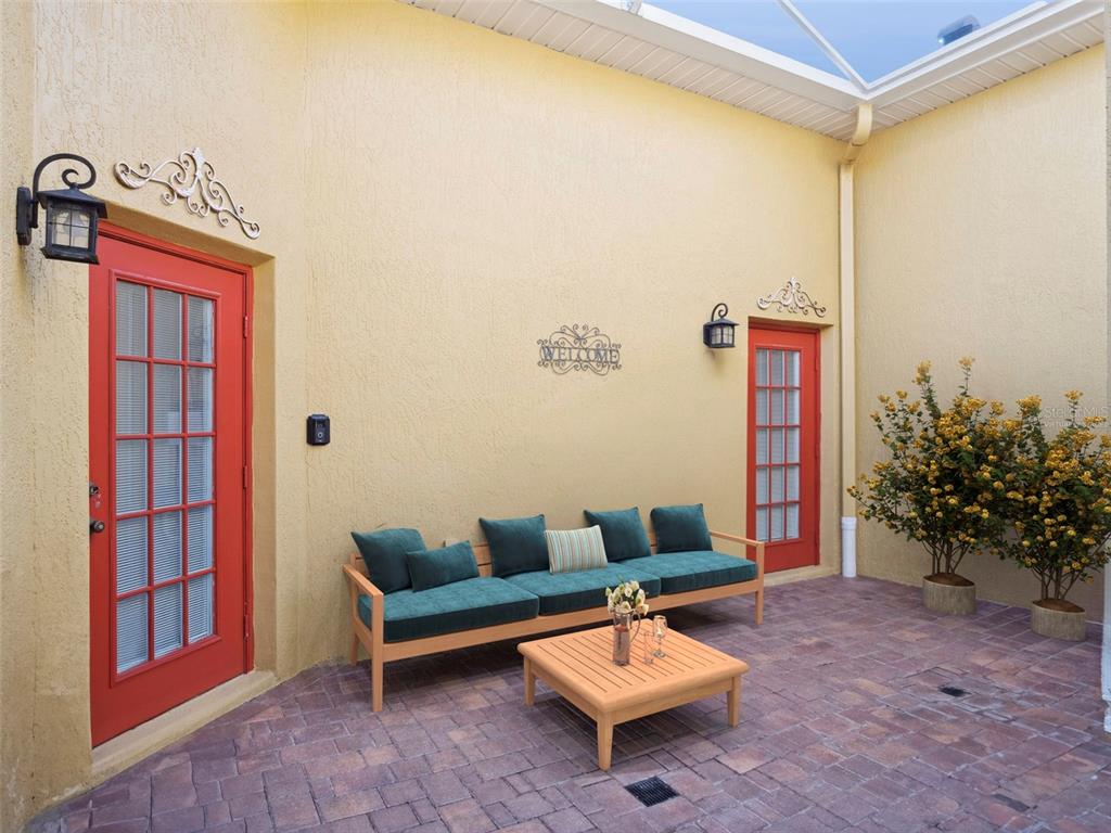 20642 Prince Ranier Place Leesburg, FL 34748 - Photo 19 of 59 a living room with furniture and a potted plant