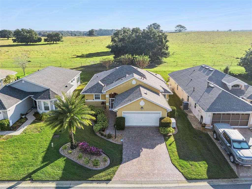 20642 Prince Ranier Place Leesburg, FL 34748 - Photo 22 of 59 an aerial view of residential houses with outdoor space and ocean view