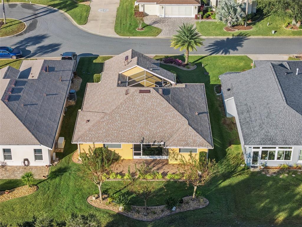 20642 Prince Ranier Place Leesburg, FL 34748 - Photo 25 of 59 an aerial view of multiple houses with yard