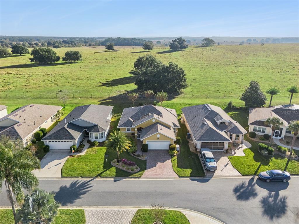20642 Prince Ranier Place Leesburg, FL 34748 - Photo 28 of 59 an aerial view of a house with outdoor space and lake view