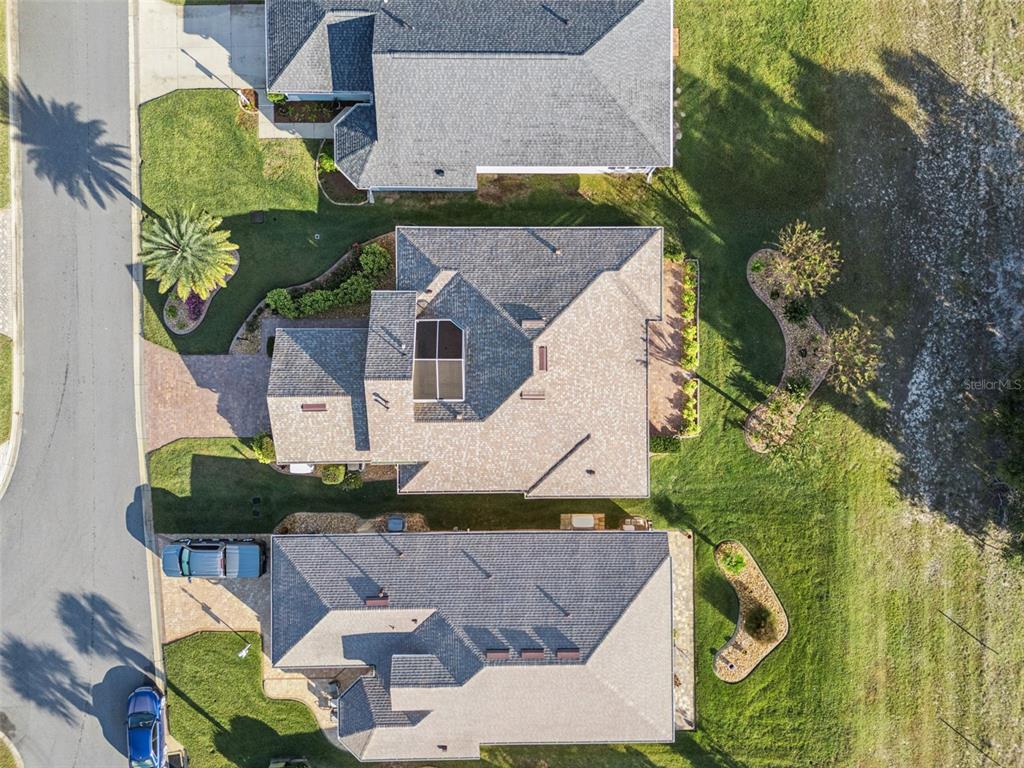 20642 Prince Ranier Place Leesburg, FL 34748 - Photo 32 of 59 an aerial view of a house with a yard basket ball court and outdoor seating