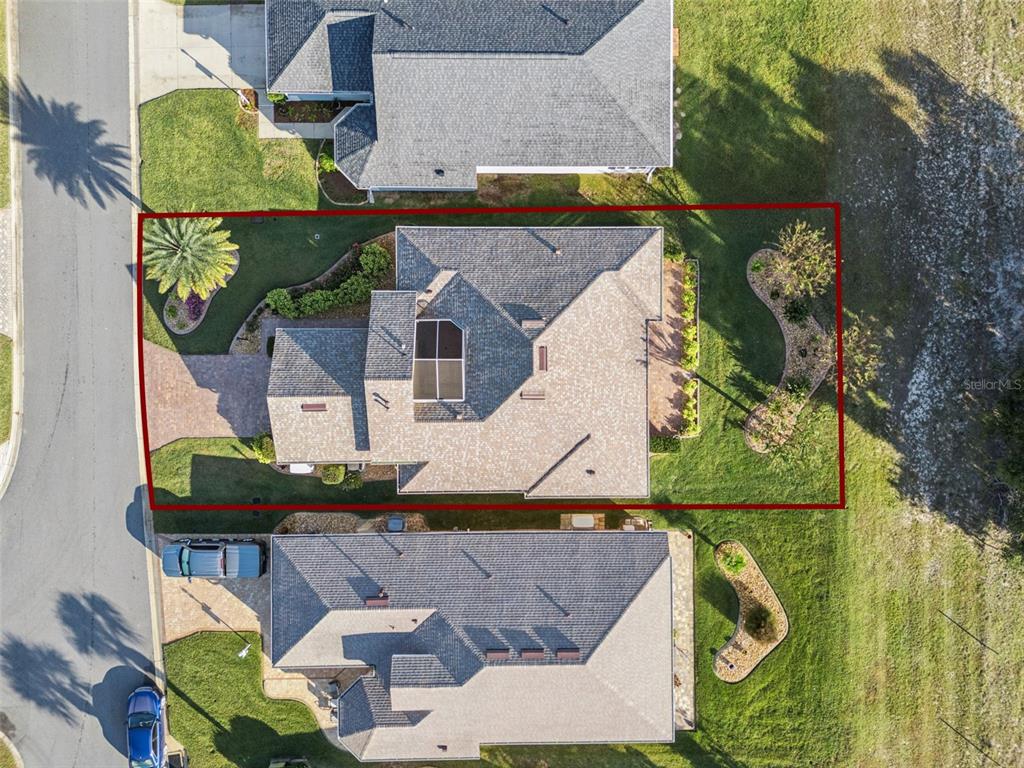 20642 Prince Ranier Place Leesburg, FL 34748 - Photo 33 of 59 an aerial view of houses with outdoor space