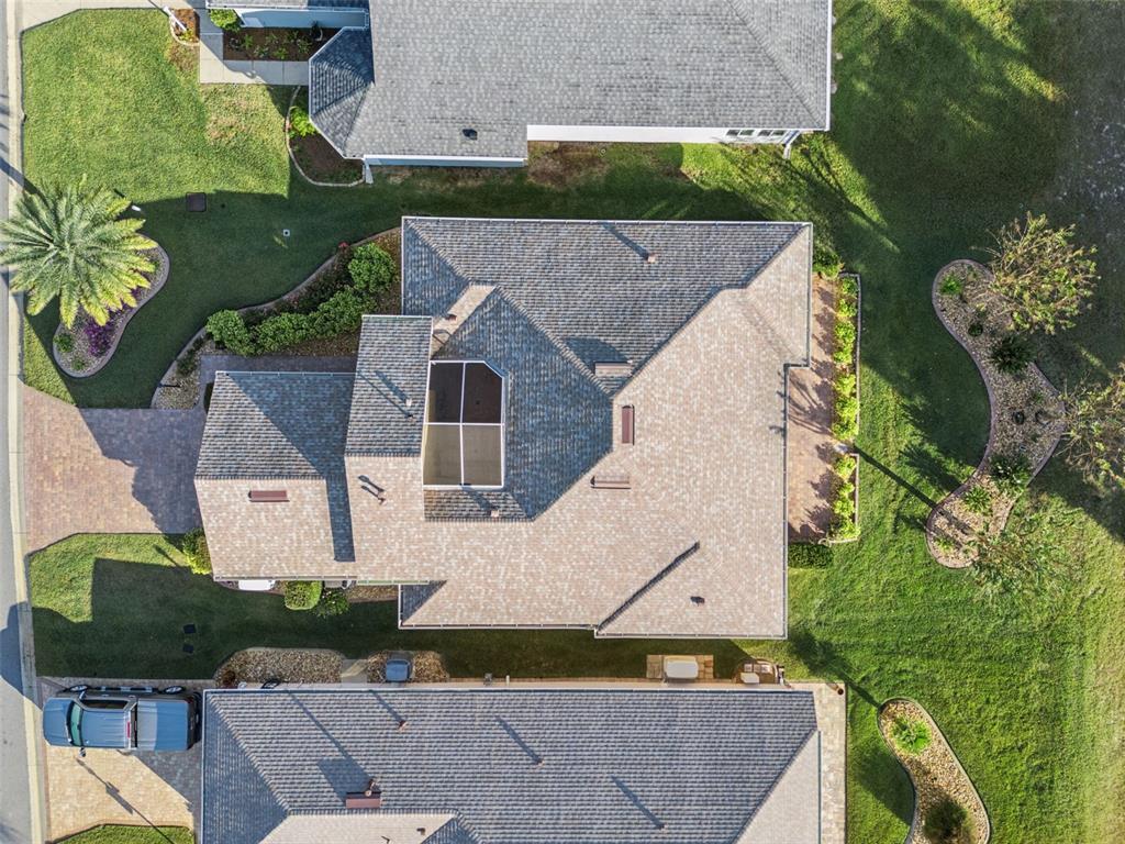 20642 Prince Ranier Place Leesburg, FL 34748 - Photo 34 of 59 an aerial view of a house with a garden