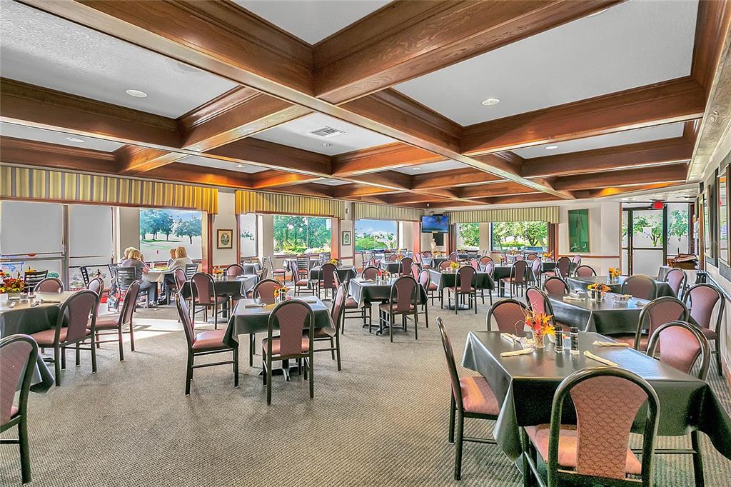 20642 Prince Ranier Place Leesburg, FL 34748 - Photo 49 of 59 a outdoor space with lots of tables and chairs