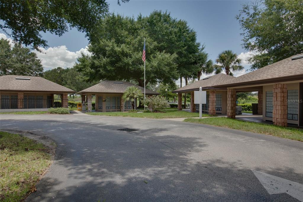 20642 Prince Ranier Place Leesburg, FL 34748 - Photo 55 of 59 a front view of a house with a garden